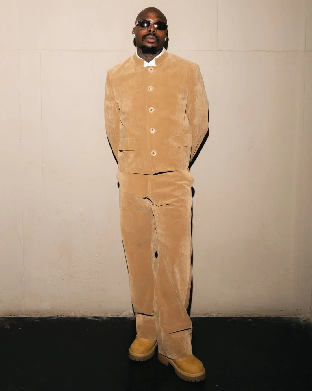 Asake closes Africa tour in a sharp tan corduroy fit
