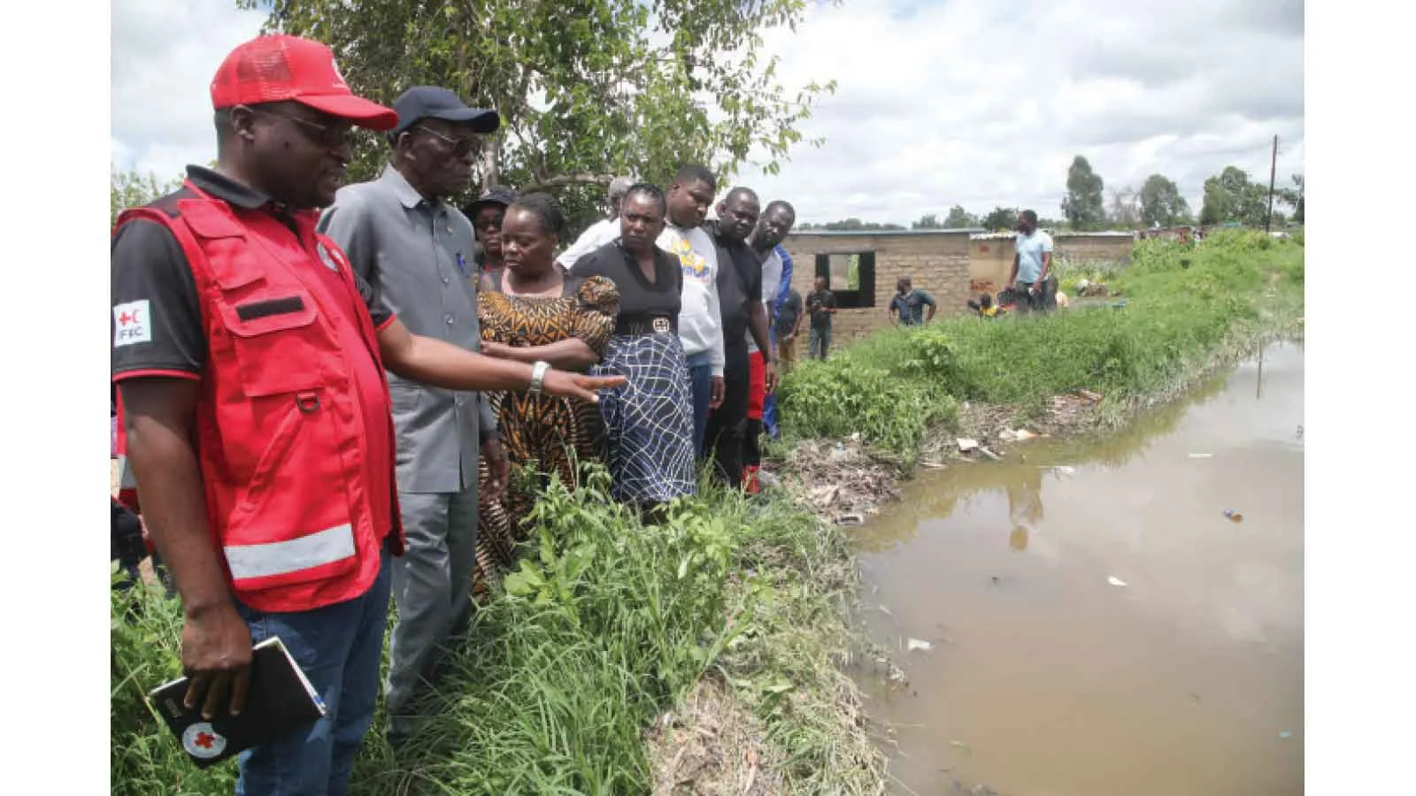 Charles Tavengwa and Zimbabwe officials relocate Epworth families