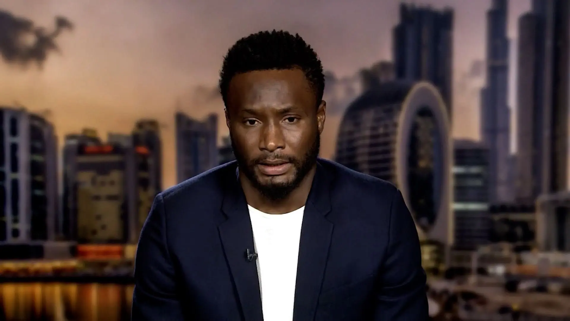 Obi Mikel drags Chelsea defenders to the dirt