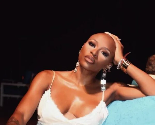 Zinhle stuns with bold bald look, matching Moozlie