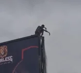 Man in suspected suicide bid climbs Kano billboard stalls traffic.webp