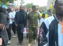 Meru Police Commander Joins Youth Protesters on Anniversary March.webp