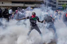 Protester killed and 17 injured as anniversary protests turn violent.webp