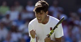 Carlos Alcaraz Battles Through Five Sets to Win Wimbledon Opener.webp
