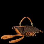 Louis Vuitton lobster wearable wallet claws cash with $7,450 price tag.webp