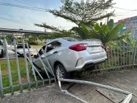 An elderly woman's wild reverse sends a car crashing through the school fence in Sungai Merah.webp
