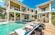 Jamaica's Airbnb licensing bill stalls in Parliament amid fines and prison threat debate.webp