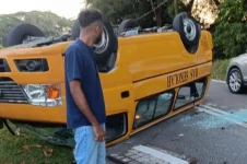 Sixteen Johor students injured as school bus overturns after hitting a pothole.webp