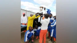 Barefoot football and grace fill Khami Prison grounds.webp
