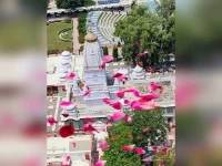 Uttar Pradesh honors Shiva devotees with aerial flower showers during Sawan month.webp