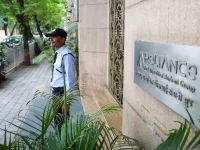 Reliance Power and Infrastructure shares hit the lower circuit after ED raids on Ambani firms.webp