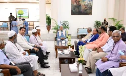Yunus urges unity to defend elections and resist chaos at the Dhaka meeting.webp