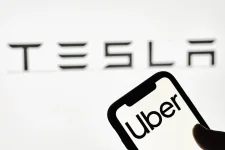 Khosrowshahi concedes Uber can't win, must partner with Tesla.webp