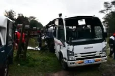 KPC offers prayers as its bus meets a Kenya Railways train.webp