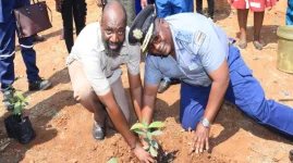 Bonde plants ten trees at Ross Camp, names one for Judith Ncube.webp