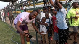 Stadium frenzy as Ajigija inks kids' faces and gango feasts lure fans.webp