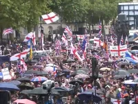 Tommy Robinson's patriots rough up some London police, Musk cheers.webp