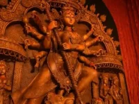 Modi wishes joy as Mamata sings for Durga Puja.webp