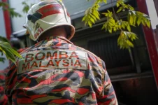 Firefighters hijack bikes to reach fiery car tragedy at Pantai Sungai Lurus.webp