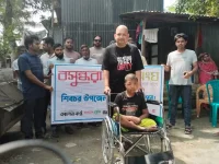 Lavlu delivers a wheelchair to crippled Kawsar in Shibchar.webp