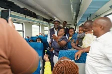 Musalia Mudavadi Shakes Hands with Train Travelers.webp