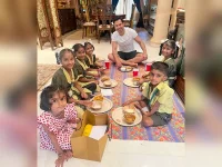 Varun Dhawan breaks bread with kids on Ashtami.webp