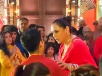 Rani and Ayan hug it out at Durga pandal.webp