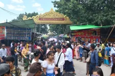 Oil lamps light Mandalay pagodas for Thadingyut.webp