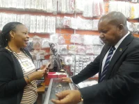 Mwenda checks the Kariakoo trade in Dar.webp