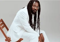 Samini advises artists to invest in land over cars.webp
