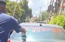 Kenyans outraged as officer sprays paint car in Nairobi.webp