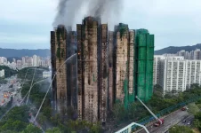 Hong Kong blaze tragedy rises, bamboo scaffolding under fire.webp