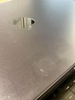 MacBook Pro survives car crush, scratched.webp