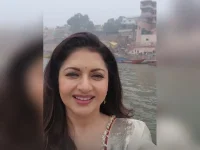 Bhagyashree floats, Ganges breeze in hair.webp
