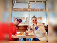 Rubina and Abhinav were stunned by the hot coffee vending machine.webp