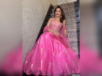 Madhuri Dixit stuns in pink, skips director chair.webp
