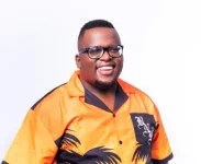 Sol Phenduka cries poverty while scooping ice cream in dishcloth shorts.webp