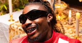 Asake mends ties with father, baby mama, and daughter.webp