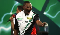 Kenyan vet turned darts star says UK run flipped his life.webp