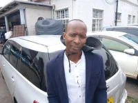 Fake Harare cop busted taking bribes outside Town House.webp