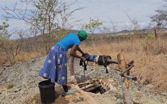 Villagers left parched as foreign mines bury wells and block rivers.gif