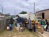 Knysna locals wait in long lines as day zero looms near.webp