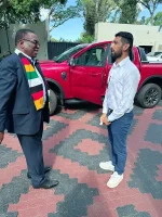 Zimbabwe captain Sikandar Raza receives a car from Mnangagwa.webp