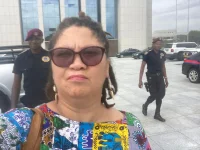 Security removes Jemima Beukes for asking oil sector questions.webp
