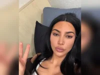 Kim Kardashian faceplants in a gold Gucci gown at the Oscars.webp