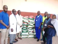 Africmed CEO Omar Jagne donates rice to staff for Ramadan.webp